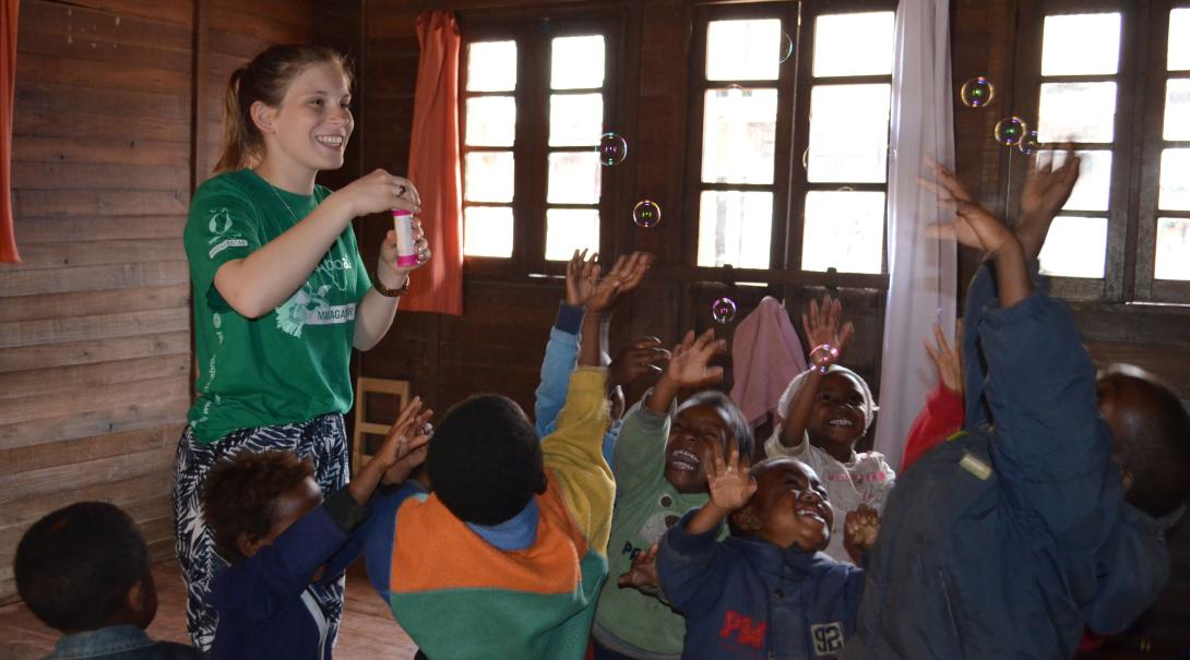 Fundraising is one way of financing your trip to Madagascar. A volunteer is having fun with children in Madagascar after she fundraised her trip to this African country.